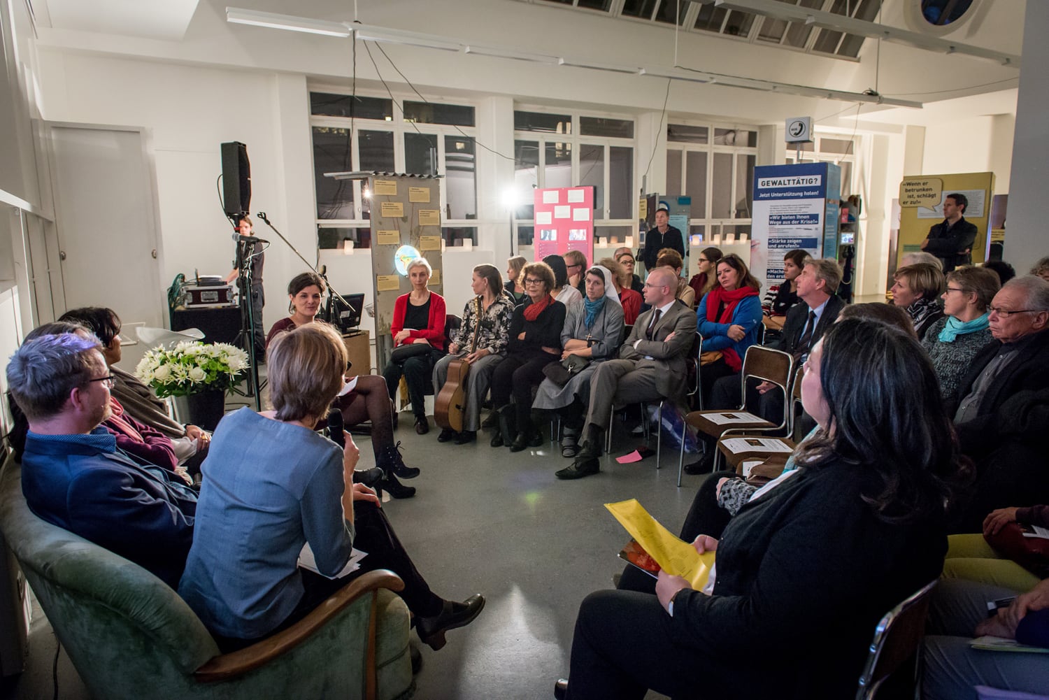 Audience and experts sit opposite each other