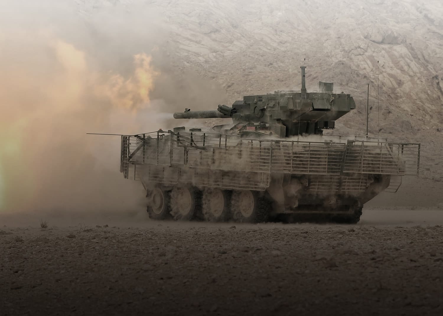 tank firing a volley in the dust